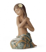 Lladro captures a different type of beauty from the South Pacific in this handcrafted porcelain figurine. With a pretty wrap skirt and flower in her hair, she's the picture of serenity.