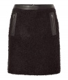 Stylish skirt in fine black arcylic-wool blend, with a hint of stretch - Fashionable leather trim at waist, and side zip pockets - Short mini-length - Fun piece for fall and winter with blouses, turtlenecks and sweaters - Try with opaque tights and ankle boots