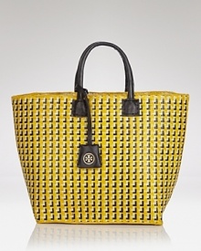 Park Avenue style goes bohemian with this woven straw tote from Tory Burch. In perfect step with the textured trend, it's as chic with pearls as it is with a printed maxi dress.