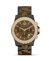 A gold-tone and crystal-rimmed bezel crowns this lush tortoise timepiece with opulent polish. From MICHAEL Michael Kors.