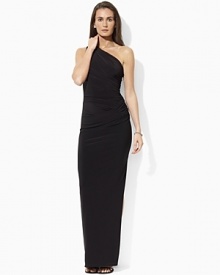 Elegantly ruched for a sophisticated statement, this gown captures the timeless glamour of a one-shoulder silhouette in curve-conscious matte jersey.