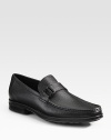 Classic slip-ons in rich leather with a side metal accent. Leather lining Padded insole Rubber sole Made in Italy