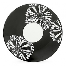 First at Bloomingdale's. These bold black and white patterns are made to mix and match. Choose five-piece place settings in floral Dogwood Point, banded Nag's Head or striped Pinney's Beach. Dogwood Point shown here.