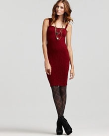 Date night becomes dramatic when you opt for this body-con Free People dress flaunting vertical stripes and diagonal knit panels at the sides. A curve-hugging silhouette that needs little else to impress, the style is complete with gold necklaces and textures stockings.