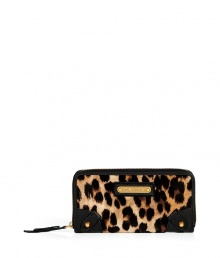 Inject an eye-catching edge into your statement accessories collection with Juicy Coutures bold leopard print zip-around wallet - Metal logo plaque, zippered back pocket, inside zippered coin pocket, bill and credit card slots - Stash away in oversized totes or carry alone for running quick errands