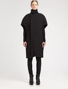 Sculptural and modern, finished with unique cape sleeves and side slash pockets.Funnel collarShort cape sleevesAsymmetrical concealed button frontSide slash pocketsAbout 42 from shoulder to hem97% cotton/3% spandexDry cleanMade in Italy of imported fabricModel shown is 5'10½ (179cm) wearing US size Small. 