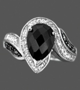 A unique ring of endless grace, featuring round-cut diamonds (1/10 ct. t.w.) and oval-cut onyx (10 x 7 mm) in a sterling silver setting. Size 7.