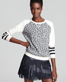 A sumptuous mix of cashmere and cotton make up this printed Gryphon sweater, unique on its own and ultra-edgy with a fringe skirt and pointy-toe heels.