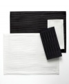 Made for celebration, the Cheers Twist placemat by Mikasa sets the scene with an understated linear pattern and dressy sheen in versatile black or white. Machine washable table linens make for an especially happy host, too.