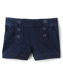 Nautical-inspired decorative buttons and sailor girl styling elevates these adorable denim shorts from GUESS Kids.