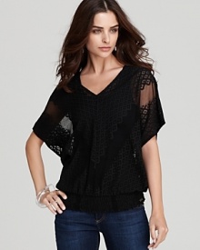 Ornately detailed, this GUESS top transitions effortlessly from day to night.