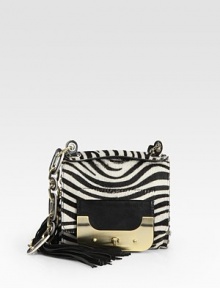 Exotic zebra-print haircalf pairs with luxe leather in this incredibly unique design, finished with a chic turnlock flap and polished chain strap.Top handle, 1 drop Shoulder strap, 12 drop Turnlock flap closure One inside zip pocket Cotton lining 6¾W X 6H X 1D Imported