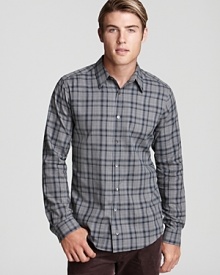 A slim-fitting button-down in comfortable cotton, adorned with an understated plaid design that shows off your keen eye for tasteful patterns.