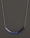 Gradient blue sapphires form a moody rainbow on this 14K. yellow gold necklace from Meira T.