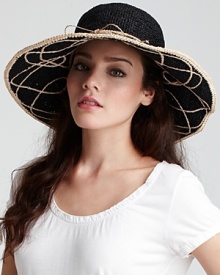 A limited edition raffia sun hat with contrast spiral stitching underneath brim for statement-making style.