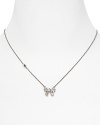 Tie on sweet sparkle with this delicate crystal bow necklace from Juicy Couture, sure to be on every girl's wish list.