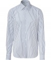 Elegant dress shirt in fine, pure patterned cotton - Traditional button down style with classic navy stripe motif - Small collar and long, cuffed sleeves - Hem hangs slightly longer in the back - Slim, straight cut - Polished and versatile, a stylish must in any wardrobe - Pair with suit trousers and a blazer, or go for a more casual look with jeans and a cardigan