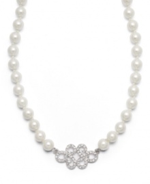 Professional poise. Lauren by Ralph Lauren's polished necklace adds a dignified element to any look. A single strand of glass pearls highlights a scroll pendant accented by pave-set glass accents. Set in silver tone mixed metal with a lobster claw clasp. Approximate length: 18 inches.