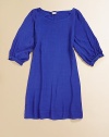 Puffed, three-quarter sleeves and a standout back zipper make this not-so-basic frock uniquely adorable.ScoopneckThree-quarter puff sleevesBack zipperRayonMachine washImported