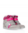 The statement shoe of the moment, these two-tone wedge sneakers from Serafini boast comfort and trend-right edge - Tonal suede toe, two-tone Velcro front closure, lace up front with wrap-around detail, neon-pink leather trim, hidden wedge heel, rubber sole - Wear with skinny jeans, a featherweight tee, and a leather jacket