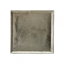 Organically molded under fire, this handmade tray exudes metal artistry with a New York edge.