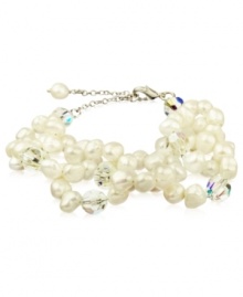 Go for a subtle hint of shimmer, or a standout look. This beautiful bracelet highlights cultured freshwater pearls and sparkling Swarovski crystal accents. Set in sterling silver. Approximate length: 6-1/4 inches + 2-inch extender.