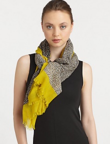 An animal print style with a solid border in lightweight wool. WoolAbout 68 X 40Dry cleanImported 