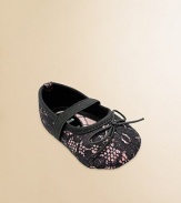 A pretty lace overlay with tiny bows and elastic straps across the instep.Polyurethane shoeRound toeElastic instep strapMicrofiber liningSoft polyurethane soleImportedAdditional InformationKid's Shoe Size Guide (European Equivalent) 