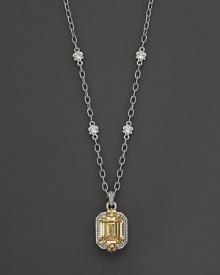 Intricately textured sterling silver and 18 K gold frame faceted canary crystal and white sapphires.. By Judith Ripka.