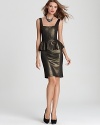 A playful peplum adorns this party-perfect metallic dress from Alice + Olivia. Add extra shine with a statement necklace.