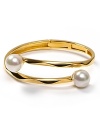 Gold makes an impact with Majorica's ripple bracelet finished with delicate pearl tips.