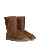 Stylishly distressed and undeniably cozy, these vintage-inspired shearling boots from UGG Australia lend comfort and style to your cold weather look - Round toe, rugged rubber sole, exposed seams, side button detail, contrasting back counter suede panel, cozy shearling lining, weathered finish - Hits above the ankle - Pair with favorite jeans, bright knits, and sporty outerwear