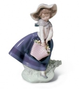 Enjoying the soft breeze and fresh flowers of spring, the little girl of Lladro's Pretty Pickings figurine exudes warmth and happiness. A classic for any collector, in glazed porcelain.