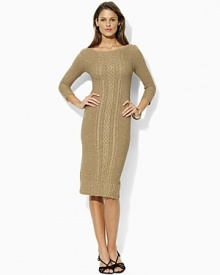 A quintessential sweater dress is updated with subtle metallic shimmer and features a traditional cable knit, three-quarter sleeves and a classic boat neckline.