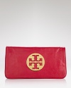 Get spotted on the street carrying this leather clutch from Tory Burch. Detailed with the brand's logo, it's an effortless way to ease into evening.