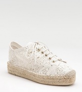 A pretty yet relaxed combo of a sneaker and an espadrille, with a lacy crocheted cotton upper on a rope-edged platform.Rope-covered heel, 1½ (40mm) Rope-edged platform, 1¼ (30mm) Compares to a ¼ heel (5mm) Crocheted cotton upper Partial leather lining Padded insole Rubber sole Made in SpainOUR FIT MODEL RECOMMENDS ordering one half size up as this style runs small. 