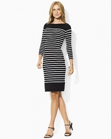 Infused with nautical inspiration, this timeless boat neck dress is finished with horizontal stripes, three quarter length sleeves and chic laced detail at the shoulders.