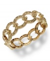 This glamorous bracelet from Charter Club is your link to on-trend fashion. Smoky topaz glass accents adorn a linked stretch design. Bracelet stretches to fit wrist. Crafted in 14k gold-plated mixed metal. Approximate diameter: 2-1/4 inches.