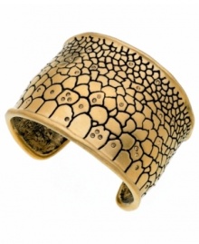 Ssseriously ssstylish! Embossed python has an exotic effect on this chic cuff bracelet from T Tahari. Embellished with sparkling Colorado crystals, it's crafted in gold tone mixed metal and nickel-free for sensitive skin. Approximate diameter: 2-1/2 inches.