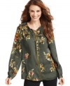 This petite tunic from Jones New York Signature features a smattering of pretty florals and a silky fabric. Pair it with your favorite jeans or pants for a complete look!