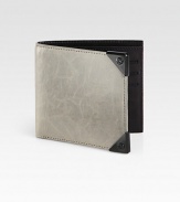 Crafted from lightly distressed lambskin leather, this sleek wallet features ample storage and the look of a well-worn favorite.One billfold compartmentSix card slotsLambskin5W x 4HImported