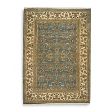 Modeled after the world's most prized antique textiles, this luxuriant Karastan rug lends opulence and heirloom beauty to your home. Surrounded by a light border to add depth and contrast, the stylized pattern depicts lush flora and curvilinear accents. First introduced in 1928, the Original Karastan Collection established the highest standard for traditional Oriental machine woven rugs.