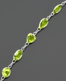 Shape your look with glowing green peridot (6-9/10 ct. t.w.). Bracelet features round, heart and oval cuts set in 14k white gold. Approximate length: 7 inches.