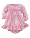 Dainty ruffles at the waist and hem add a hint of delicacy to a relaxed cotton dress and bloomer.