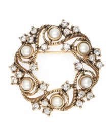 Holiday spirit. Monet celebrates seasonal style with this festive wreath brooch. Crafted in gold tone mixed metal, it's adorned with elegant glass pearls and sparkling clear glass accents. Item comes packaged in a gift box. Approximate diameter: 1-3/4 inches.