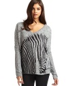 THE LOOKV-neckLong sleevesZebra graphicTHE FITAbout 27 from shoulder to longest part of hemTHE MATERIAL95% polyester/5% spandexCARE & ORIGINMachine washMade in USA