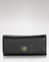 A round the clock wardrobe calls for hardworking accessories like this Tory Burch wallet, ideally sized to keep the essentials organized.