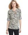 Add safari style to your spring wardrobe with this MICHAEL Michael Kors animal-printed blouse!