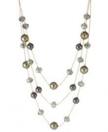 Style comes in layers in this illusion necklace from Kenneth Cole New York. Crafted from gold-tone mixed metal, the necklace is draped with green glass pearls and beads for a visually stunning effect. Item comes packaged in a signature Kenneth Cole New York Gift Box. Approximate length: 16 inches + 3-inch extender. Approximate drop: 3 inches.