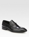 Handsome slip-on loafer style rendered in luxurious leather, with metal bit detail.Leather upperLeather liningPadded insoleLeather soleImported